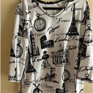White knit top with " Europe travel " theme.  2X